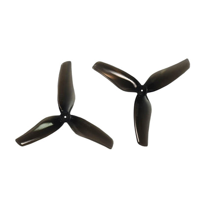 Two black 3-blade drone propellers shown as a matching set, top views on white background