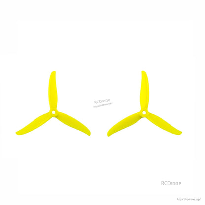 Yellow 3-blade propeller pair (CW and CCW), top view on white background