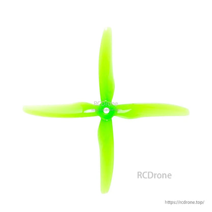 Neon green 4-blade propeller, top view showing blade profile and mounting hole