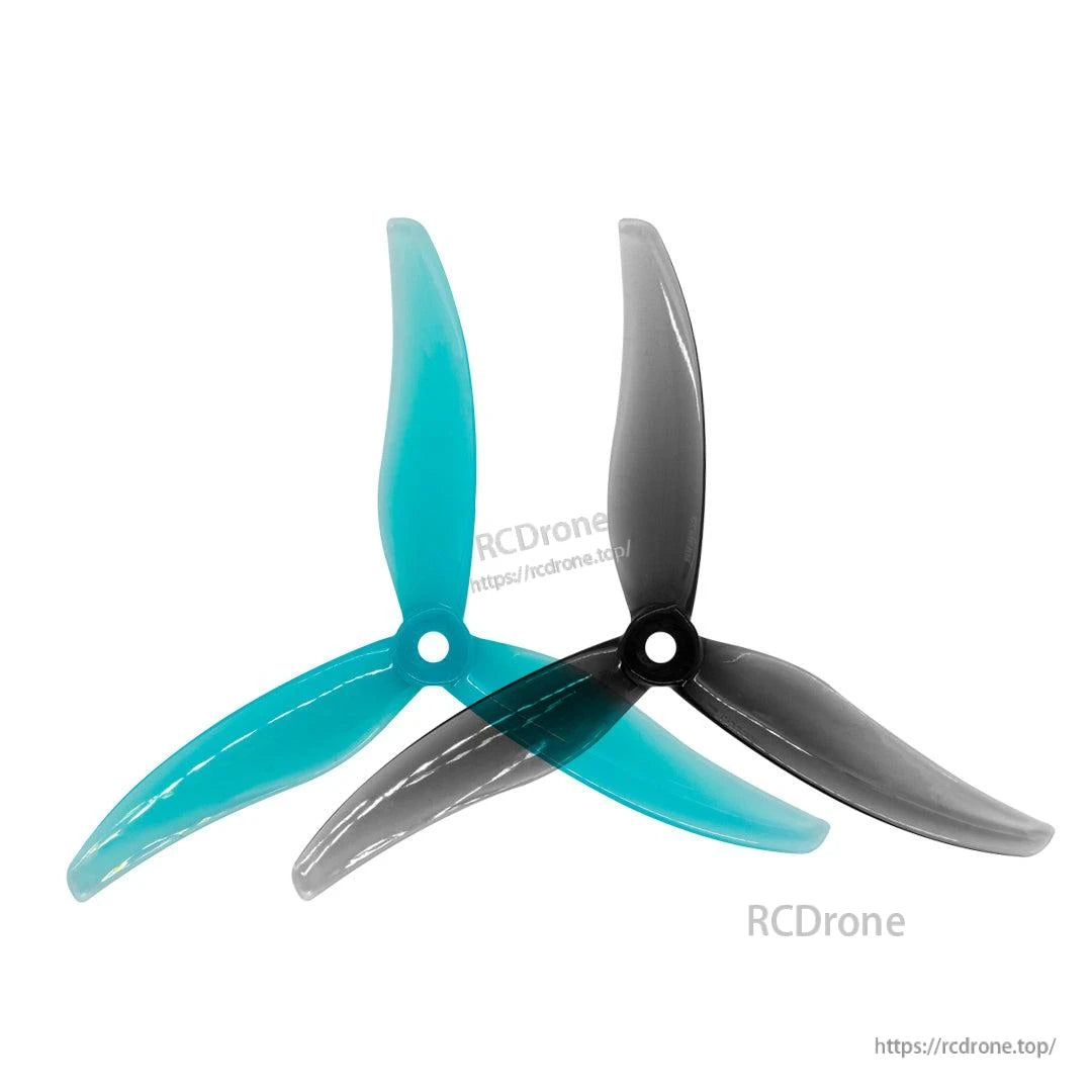 Clear blue and smoke gray tri-blade propellers shown side by side for color comparison