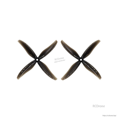 Pair of midnight gray 4-blade propellers laid side by side, matching rotation set (2 props)