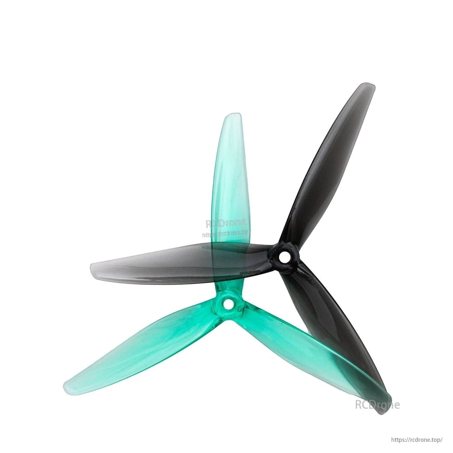 Clear green and clear gray 3-blade propellers overlapped to compare colors and hub style