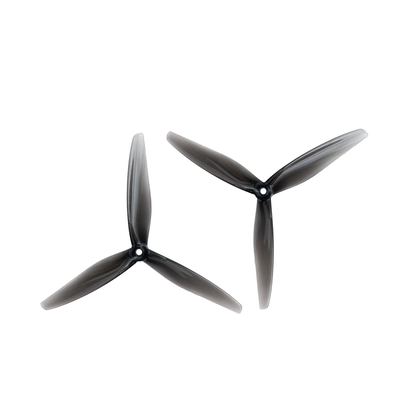 Pair of clear gray 3-blade 7-inch propellers shown at two angles, matching set