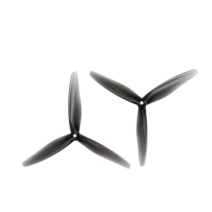 Pair of clear gray 3-blade 7-inch propellers shown at two angles, matching set