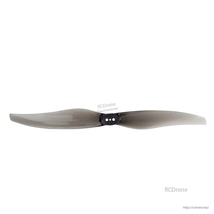 Smoke gray propeller shown straight-on, three-hole hub detail visible