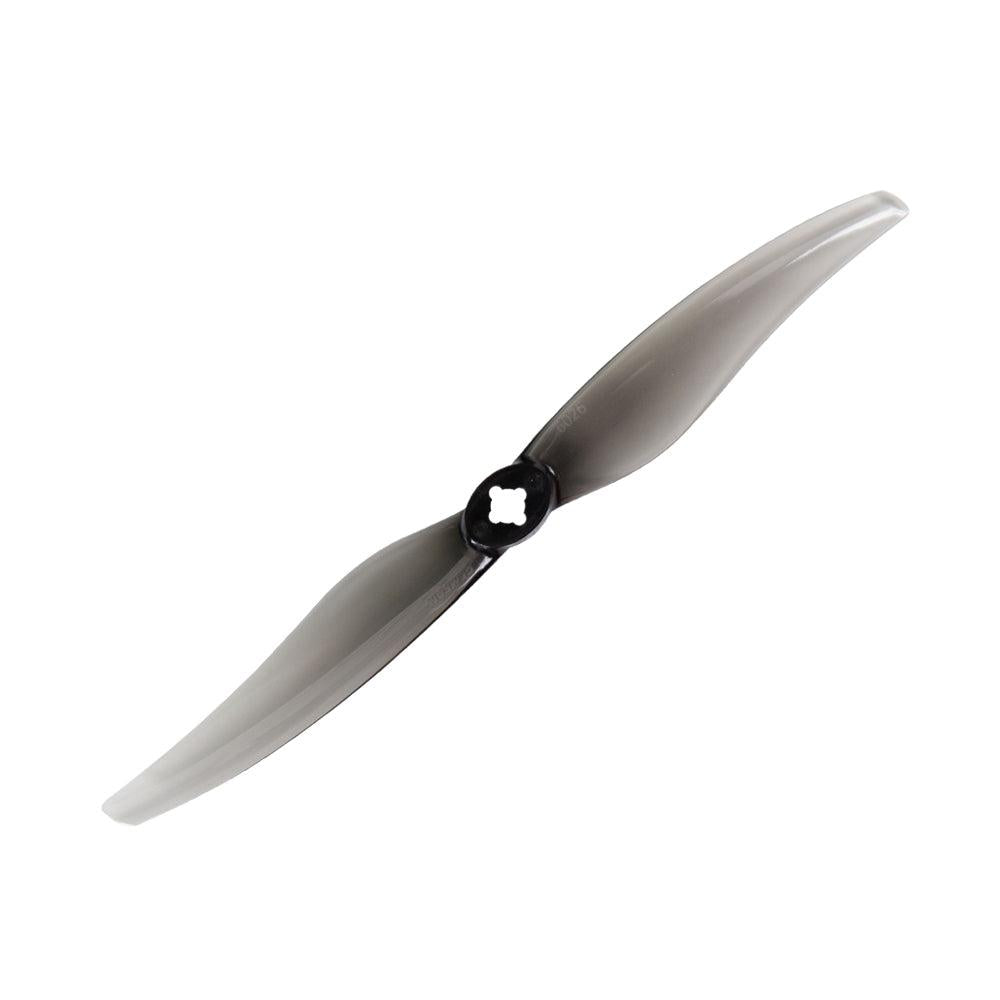 Smoke gray two-blade drone propeller with black hub, angled top view
