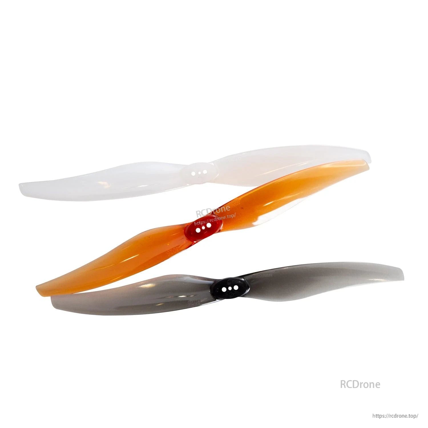 Stacked propellers in three colors: clear, orange, and smoke gray