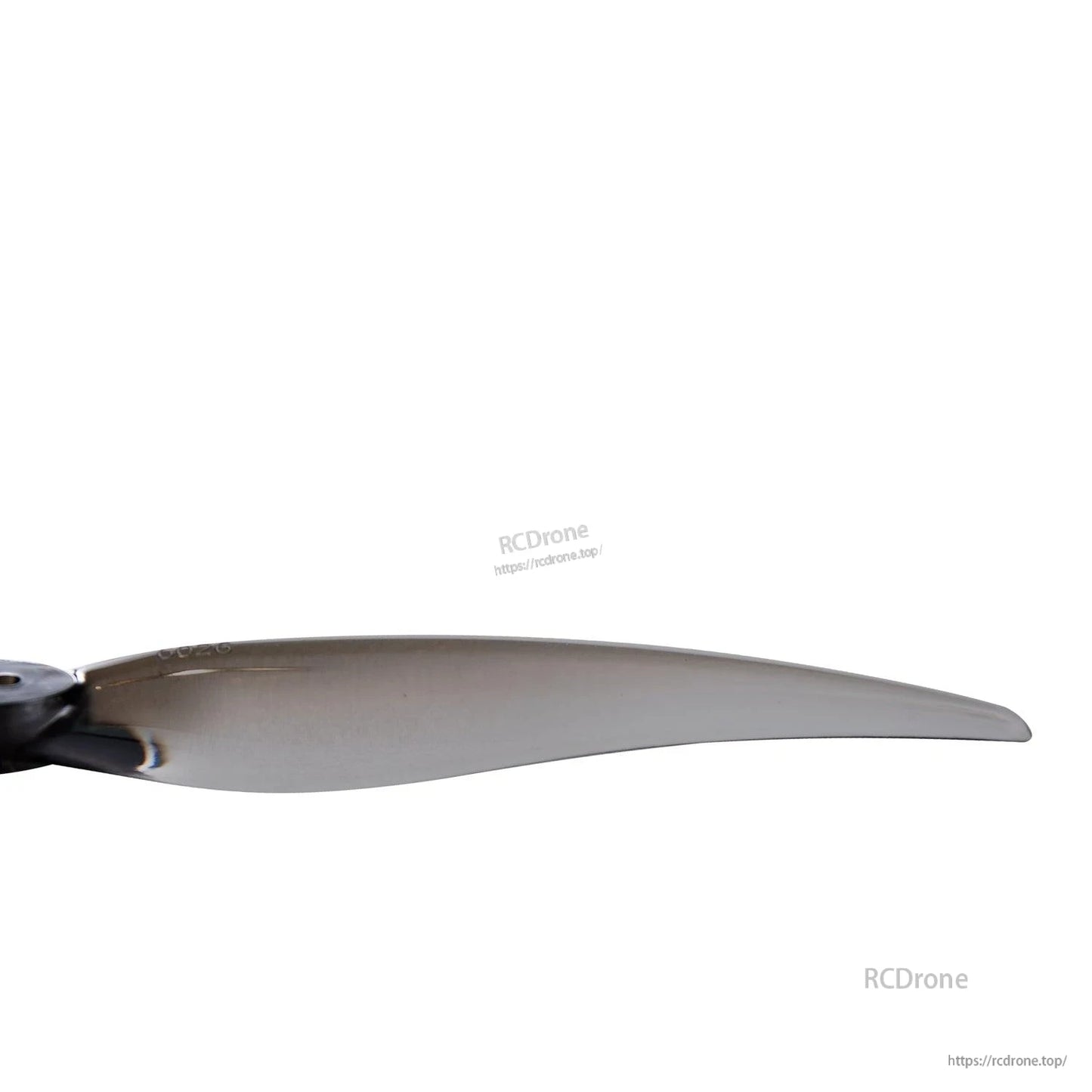 Close-up of smoke gray propeller blade section showing thickness and edge profile