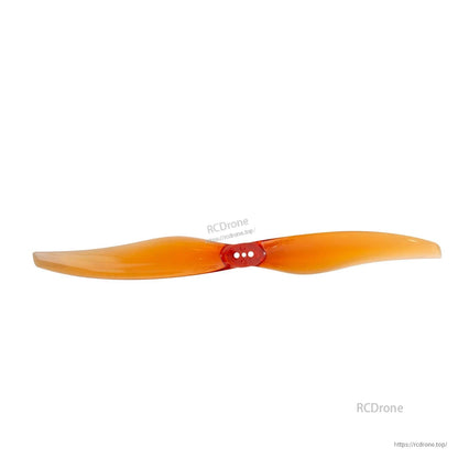Orange two-blade propeller straight-on view with three-hole mounting hub