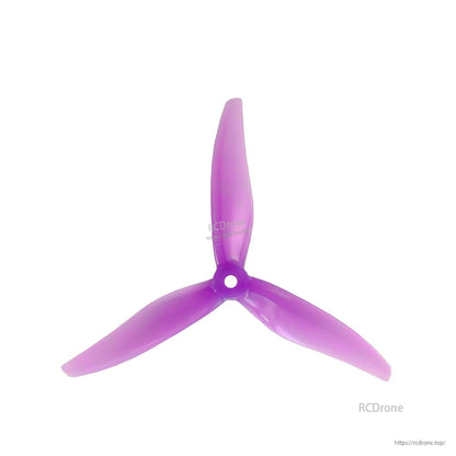 Purple translucent 3-blade propeller, top view showing blade shape and hub bore