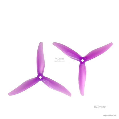 Pair of purple 3-blade propellers (CW and CCW), laid out on white background