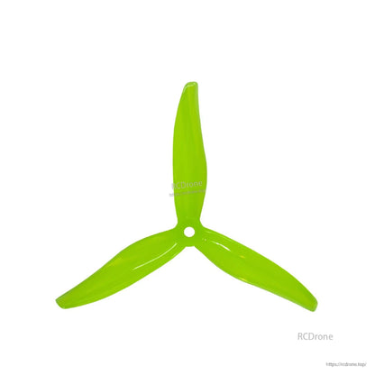 Neon yellow 3-blade propeller, top view with center mounting hole