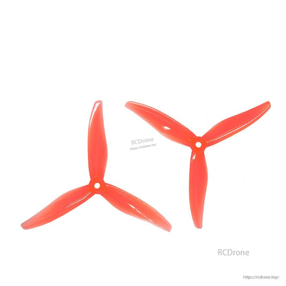Pair of peach/orange 3-blade propellers (CW and CCW), matching set on white