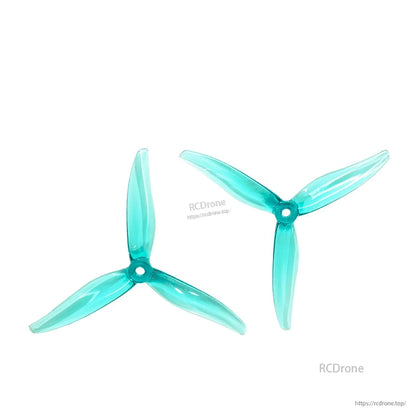 Pair of transparent cyan 3-blade propellers (CW and CCW), matched set on white