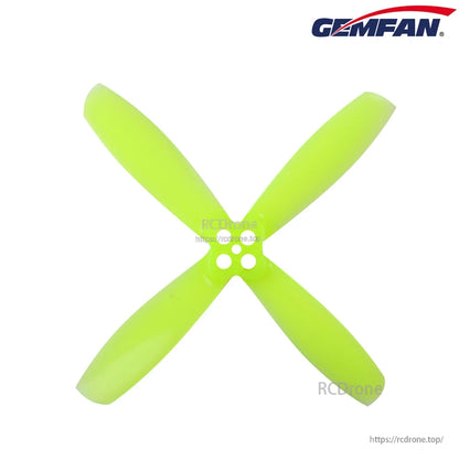 Neon green four-blade RotorX 2535-style propeller, top view with 2-hole hub