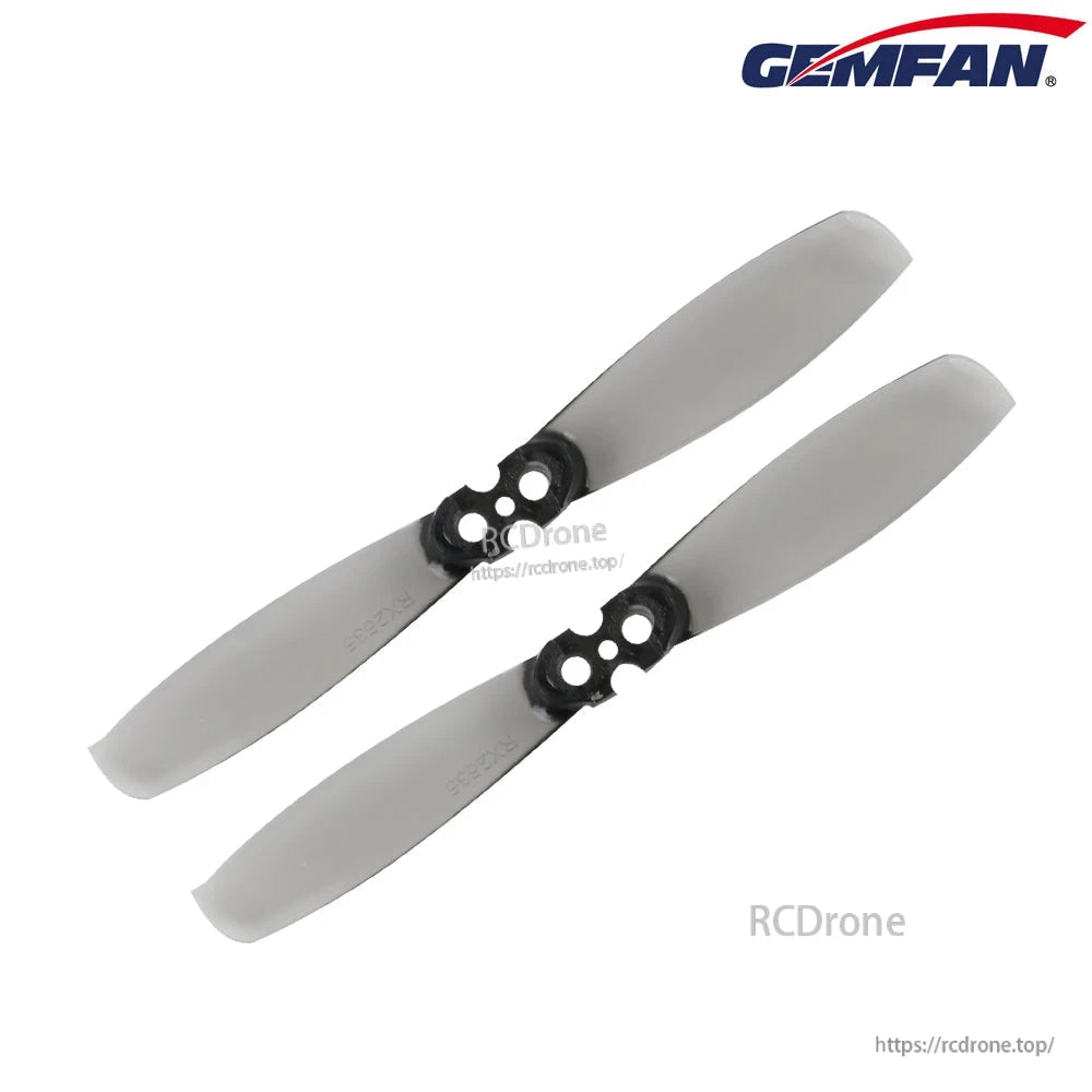 Pair of gray two-blade propellers with 4-hole mounting hub, angled view