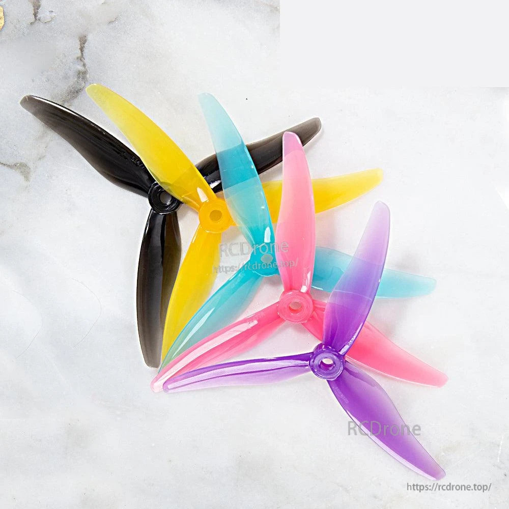 Assorted Gemfan JB Hurricane propellers in mixed colors stacked together, set overview