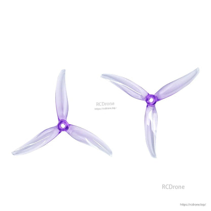 Clear purple tri-blade drone propellers, pair shown from two angles