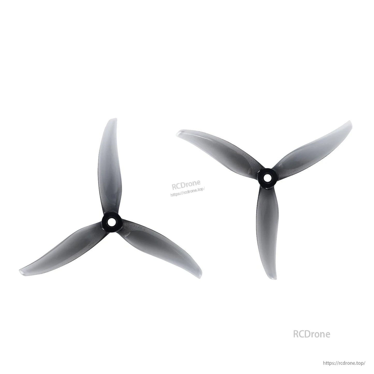 Smoke gray tri-blade drone propellers, pair shown from two angles
