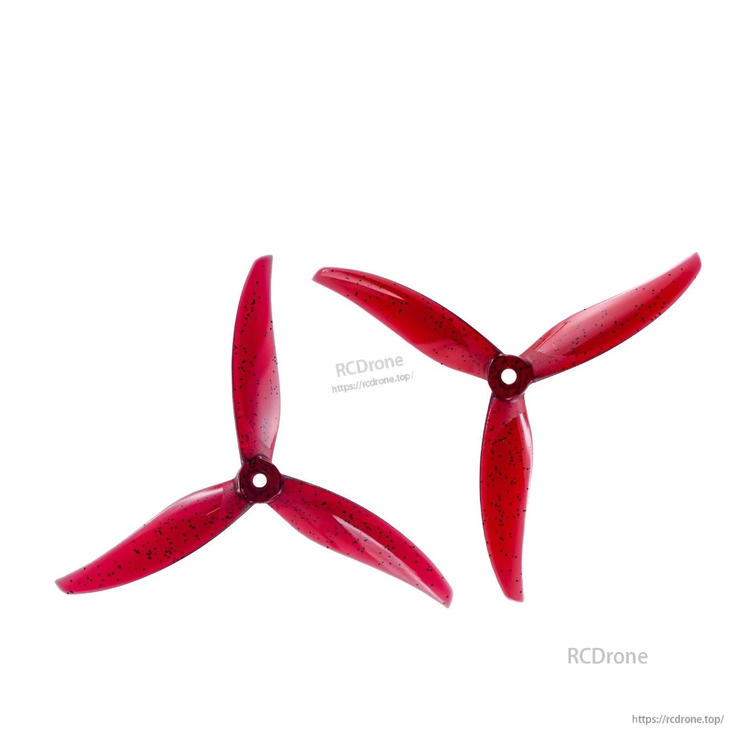 Two red tri-blade propellers with black speckle finish, angled top views