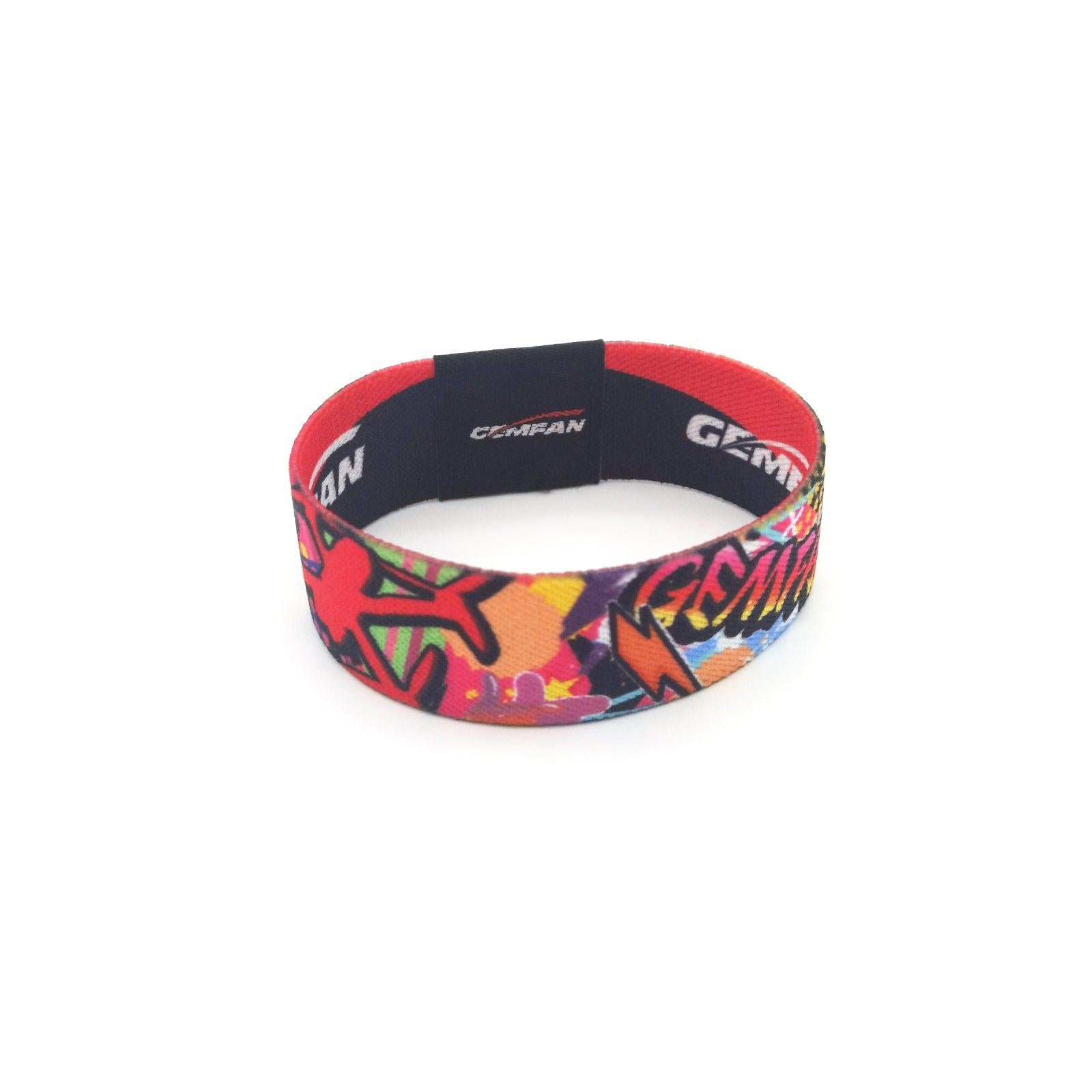 Close-up of colorful Gemfan strap outer print and red inner lining, looped band view