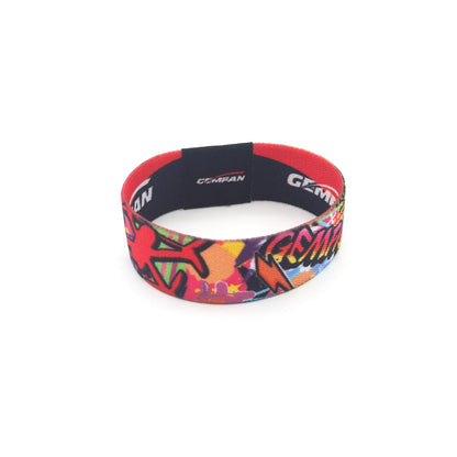 Close-up of colorful Gemfan strap outer print and red inner lining, looped band view