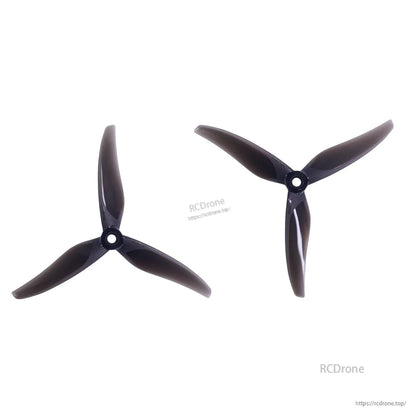 Gemfan Thomas 5127.9-3 3-Blades Propeller, Two black Gemfan Thomas 5127.9-3 tri-blade drone propellers with center mounting holes on white.