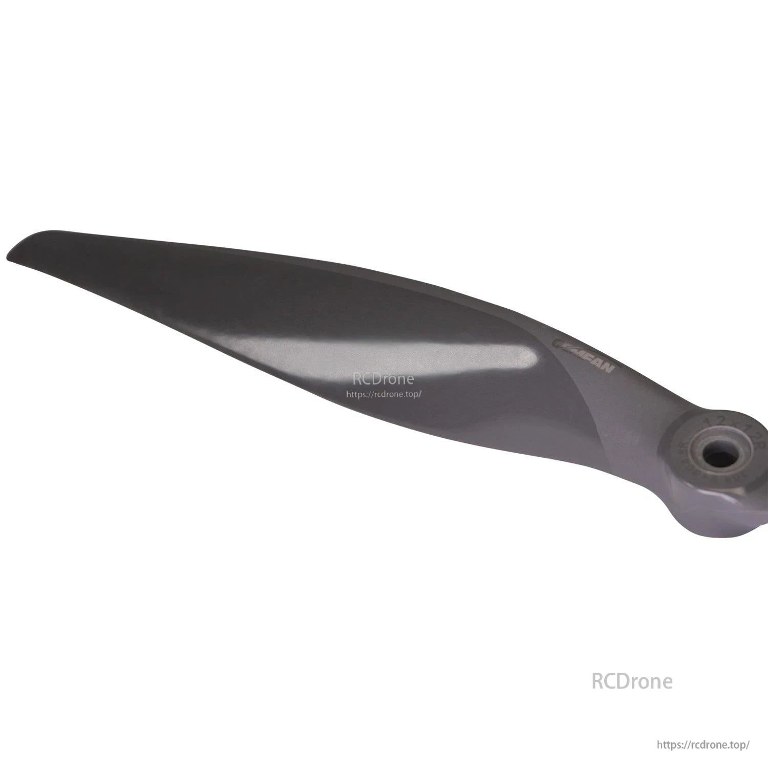 Blade tip close-up showing leading edge curve and glossy finish
