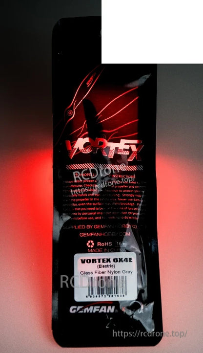 Package label close-up showing VORTEX 6x4E text on product sticker