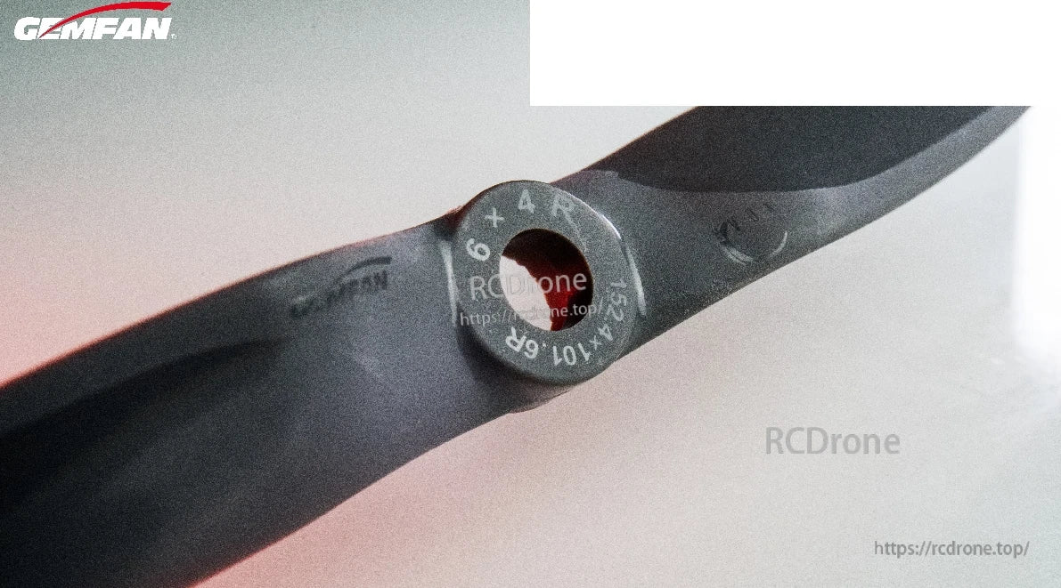 Close-up of propeller hub with molded size marking “6x4R” on the center ring