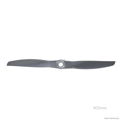 Wide horizontal view of gray two-blade propeller centered on hub opening