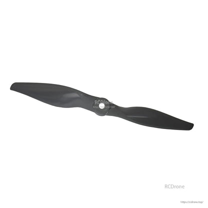 Diagonal view of gray 2-blade propeller emphasizing blade twist and curvature near the tips