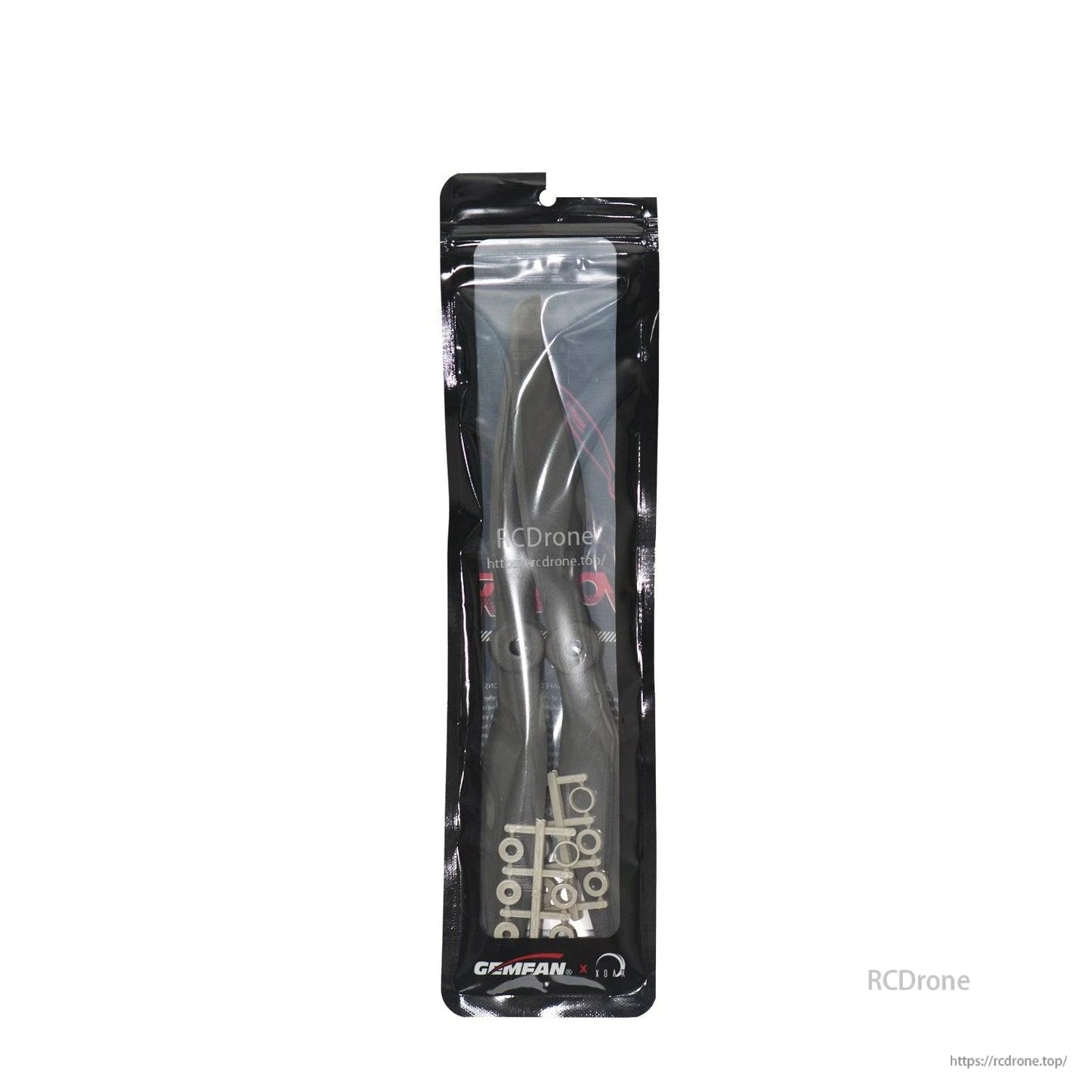 Sealed Gemfan propeller pack showing two blades and accessory rings inside