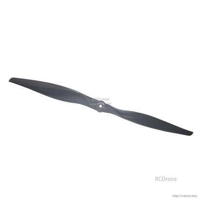 Diagonal top view of black two-blade propeller showing hub detail and blade curvature