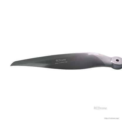 Close-up of propeller blade section showing leading edge shape and surface finish near the hub