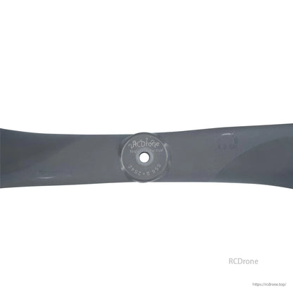Hub close-up showing center bore and molded size markings on the propeller