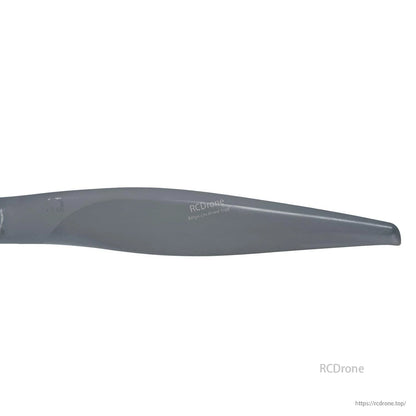 Close-up of propeller blade tip showing leading edge shape and surface finish
