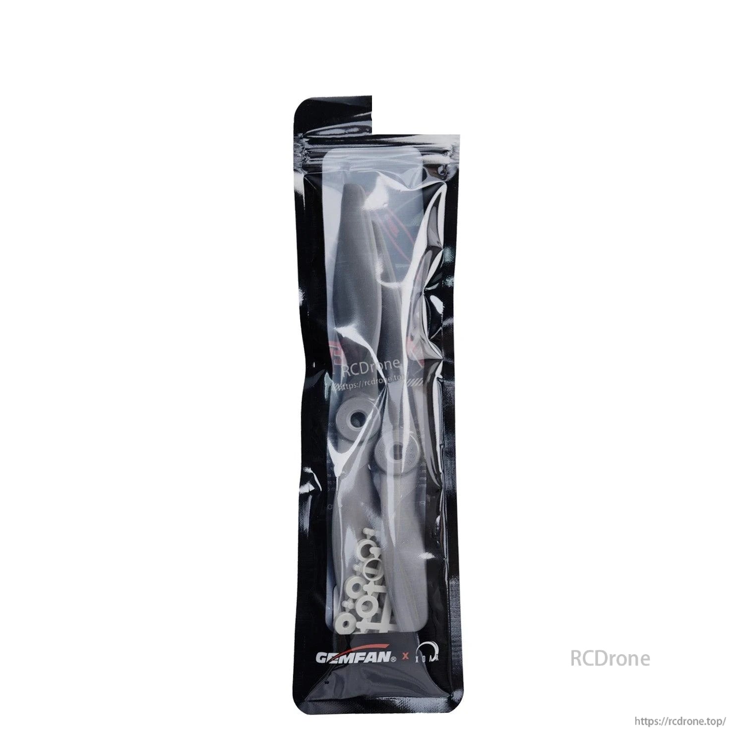 Gemfan propeller set in clear retail pouch, close-up of packaging and included adapter rings