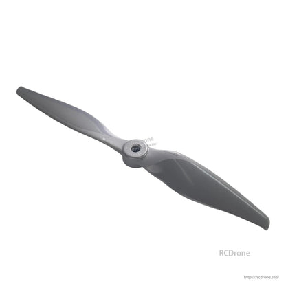 Angled view of two-blade propeller highlighting curved blade shape and hub