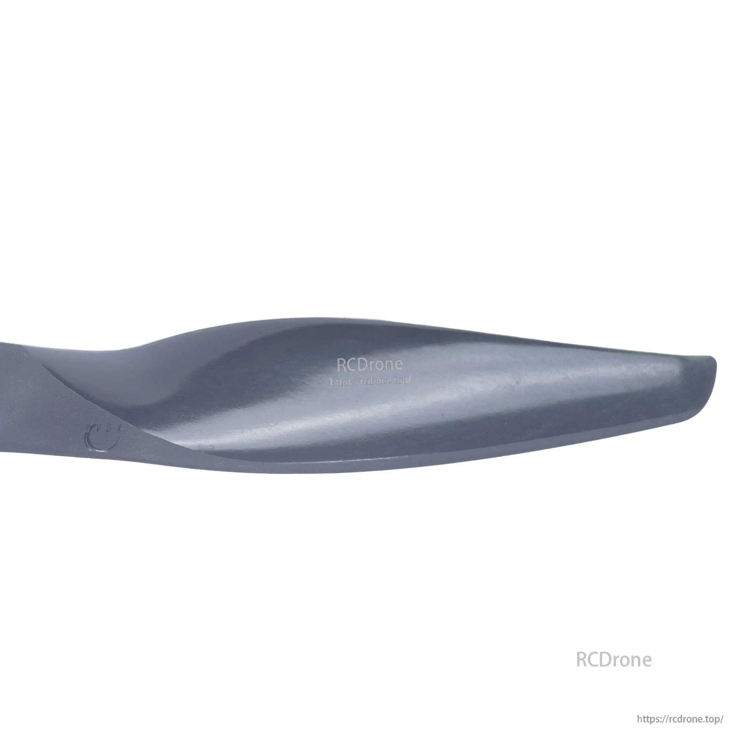 Blade tip close-up showing airfoil curve and leading edge on gray propeller