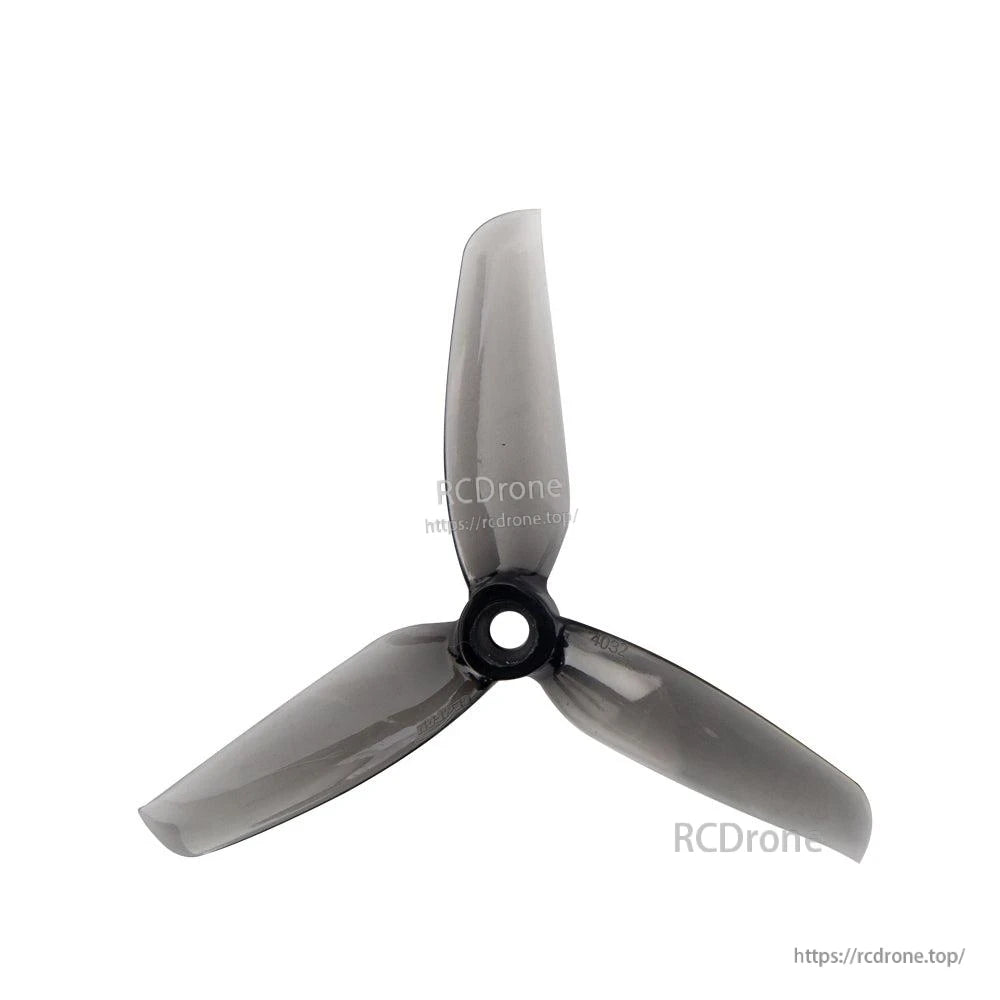 Smoke gray 3-blade propeller, top view showing translucent blades and center mounting hole