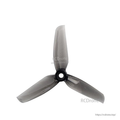Smoke gray 3-blade propeller, top view showing translucent blades and center mounting hole