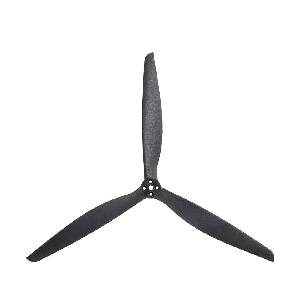 Black 3-blade drone propeller with 4-hole mounting hub, top view