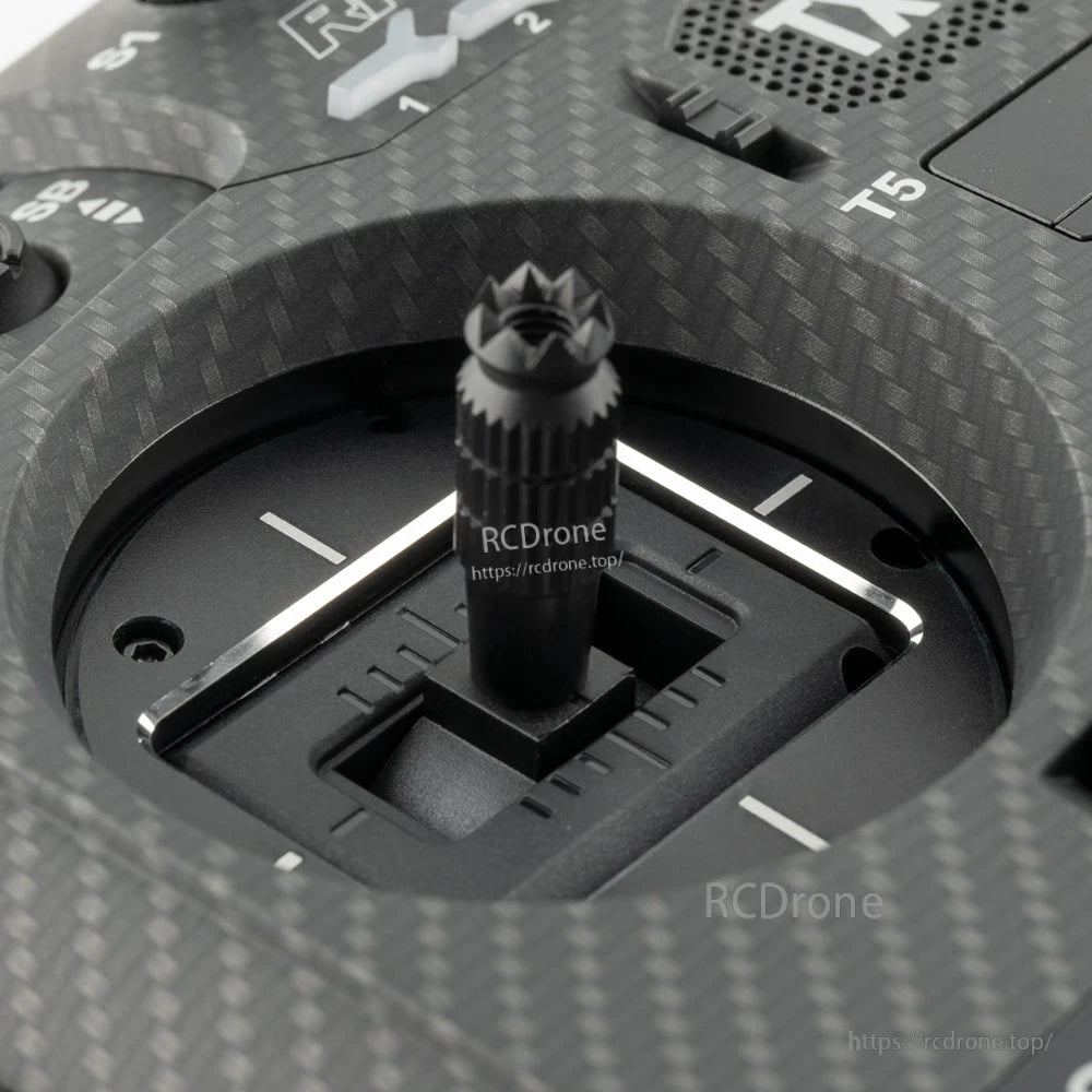 Top view of transmitter stick opening with spacer fitted, carbon-fiber style faceplate detail