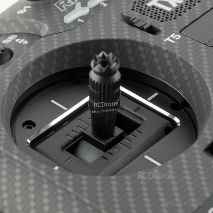 Top view of transmitter stick opening with spacer fitted, carbon-fiber style faceplate detail