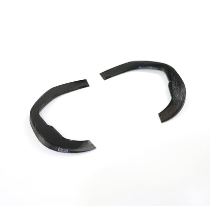Angled view of the 3D-printed curved goggle shim wedges, black plastic pair showing thickness