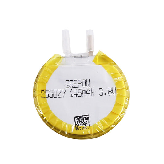 Grepow 2530027 round LiPo battery labeled 145mAh 3.8V, coin-shaped cell with dual terminals and yellow wrap