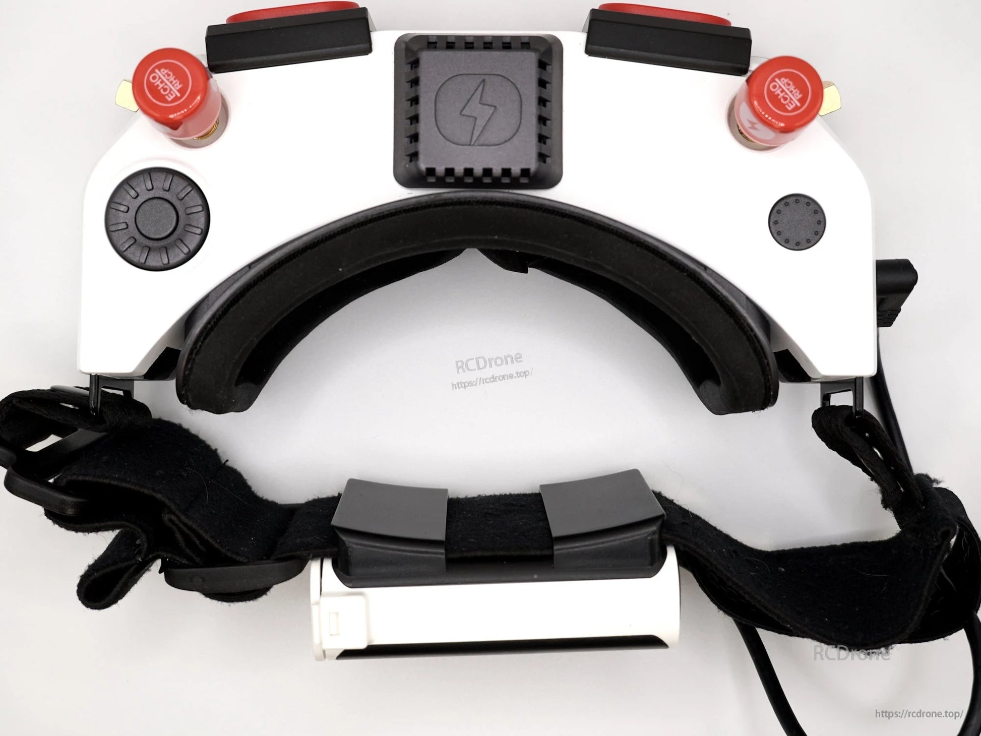 Top view of white FPV controller with strap and red thumbsticks attached