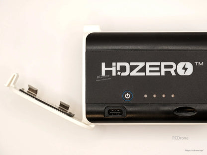 Side close-up of HDZero case with battery door open, highlighting USB-C port and front panel