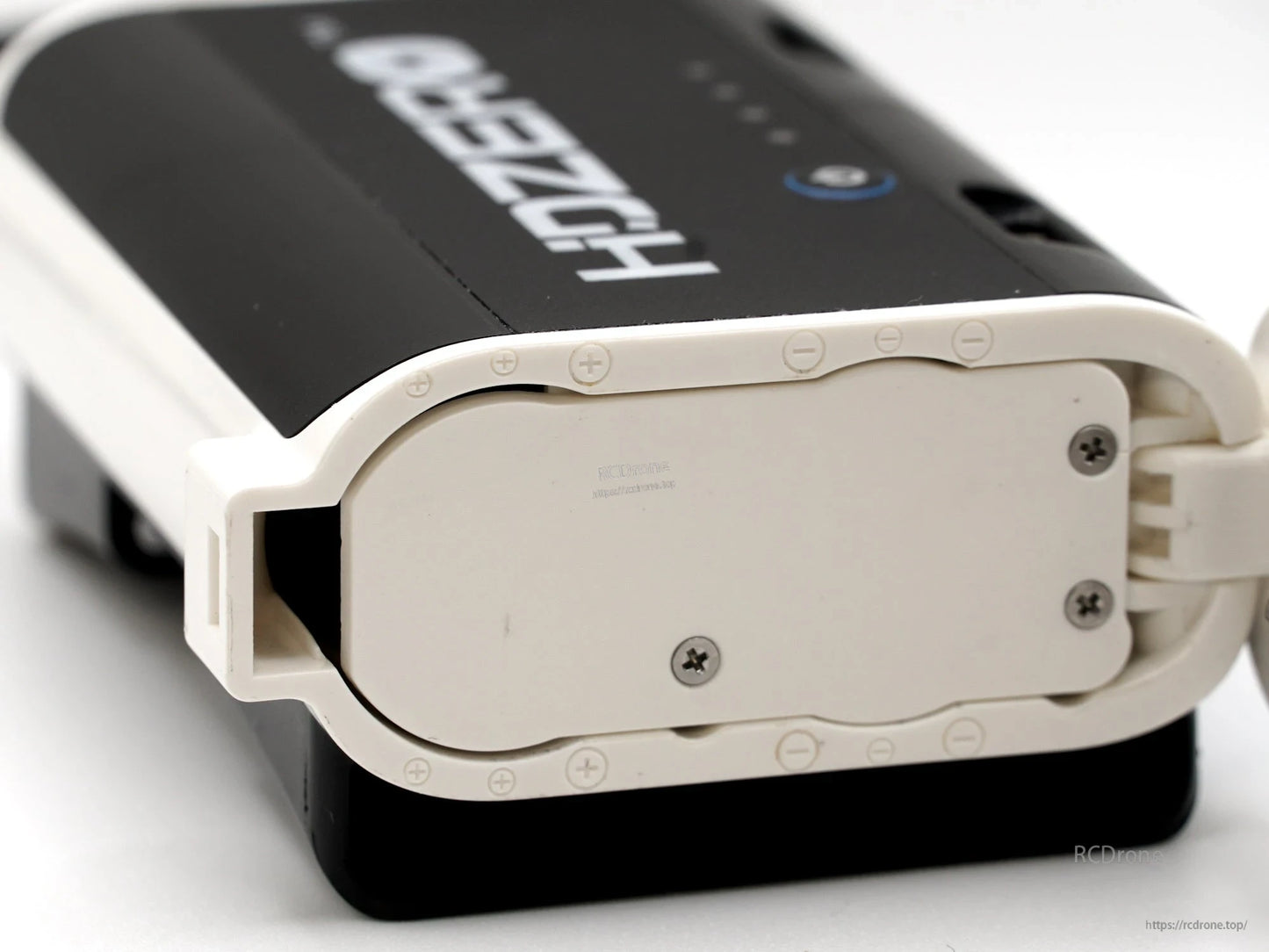Bottom view of the rear-mount battery case showing the base plate and visible screw mounts